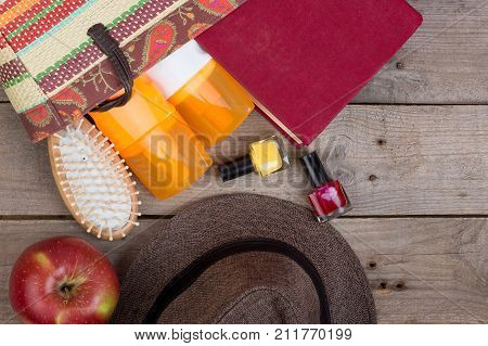 Beach Accessories - Hairbrush, Orange Towel, Hat, Sun Cream, Lotion, Beach Bag, Nail Polish, A Book