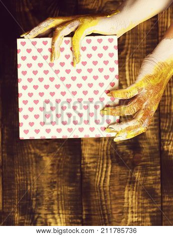 Female Hands Holding Valentine Present