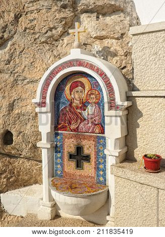 MONTENEGRO, DANILOVGRAD - AUGUST 10, 2017: Mosaic icon of Virgin Mary and baby Jesus in male Orthodox monastery Ostrog interesting place