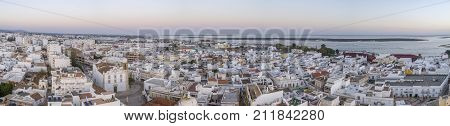 Sunset aerial cityscape in Olhao Algarve fishing village view of ancient neighbourhood of Levante and its traditional cubist architecture. Portugal.