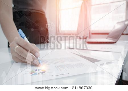 Business And Finance Investment Concept. Businessman Check About Cost And Doing Finance Graph Report