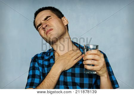 Portrait Man Coughing, Pressing On Chest With Painful Expression.