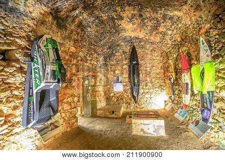 Nazare, Portugal - August 15, 2017: Surfers museum exhibition inside Fortress of St. Michael in Nazare Sitio near North Beach, one of the most impressive surf sites in the world.World-class surfboards