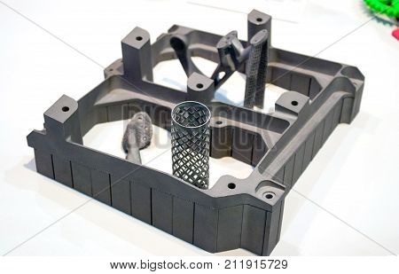 Object printed on metal 3d printer isolated on white background close-up. A model created in a laser sintering machine close-up. DMLS, SLM, SLS technology. Progressive modern additive technology.