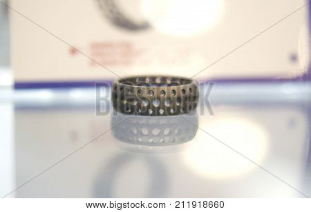 Object printed on metal 3d printer. A model created in a laser sintering machine close-up. DMLS, SLM, SLS technology. Concept of 4.0 industrial revolution. Progressive modern additive technology.