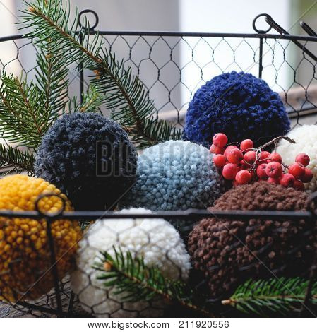 pompon from the hats in the basket like Christmas decorations