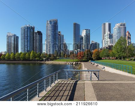 Looking at buildings of downtown Vancouver and David Lam Park from the edge of David Lam Park