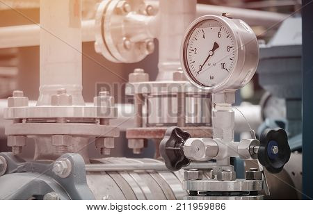 Pressure gauge on discharge pump in industrial plant Oil and gas pressure gauge in factory