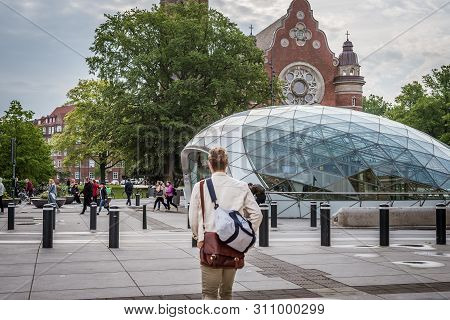 Man Walking To The Entry Of The Railway Station Triangeln In Malmo, Sweden, May 21, 2019