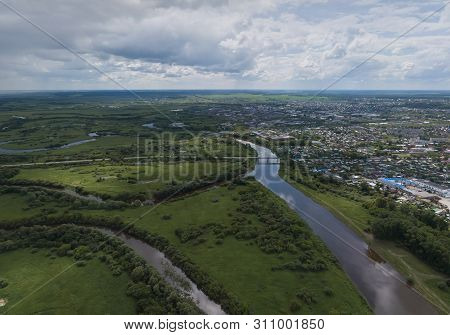 Irbit City And River. Russia. Aerial. Summer, Cloudy.  A Lots Of Trees And Grass