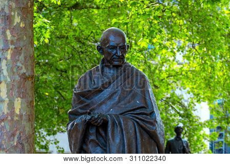 London, Uk - May 13 2018: Statue Of  Mahatma Gandhi At The Parliament Square With Other Twelve Statu