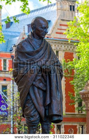 London, Uk - May 13 2018: Statue Of  Mahatma Gandhi At The Parliament Square With Other Twelve Statu