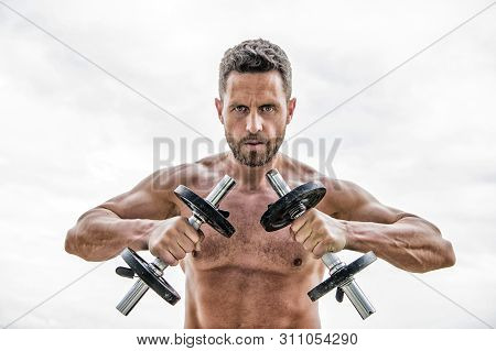 Go Wild. Success. Perfect Biceps. Muscular Man Exercising In Morning With Barbell. Man Sportsman Wei