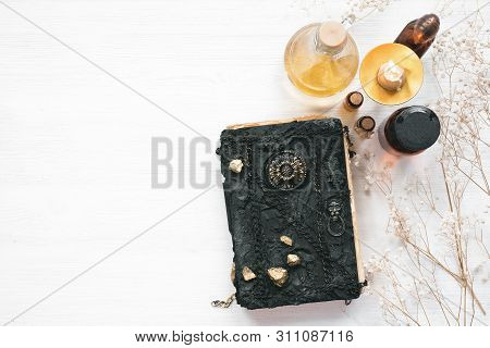 Magic Recipe Book Of Witch Doctor, Dried Herbs And A Magic Potion On A Wooden Table. Witchcraft Back