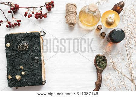 Magic Recipe Book Of Witch Doctor, Dried Herbs And A Magic Potion On A Wooden Table. Witchcraft Back