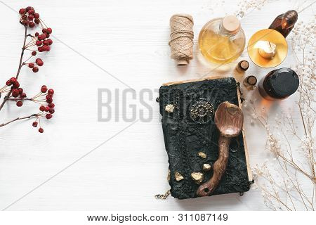 Magic Recipe Book Of Witch Doctor, Dried Herbs And A Magic Potion On A Wooden Table. Witchcraft Back