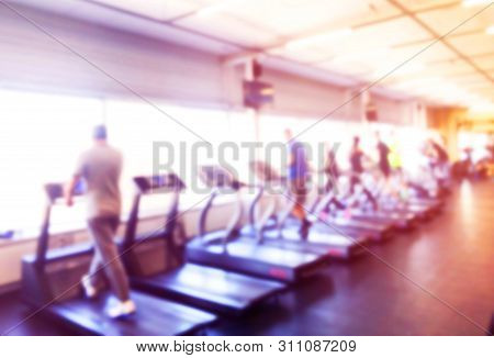 Blurred Background With Fitness Gym People Cardio Workout In Sport Club Center. Blurred Picture Of R