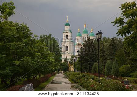 Astrakhan. Cathedral Of The Assumption Of The Blessed Virgin Mary. Golden Domes On A Background Of T
