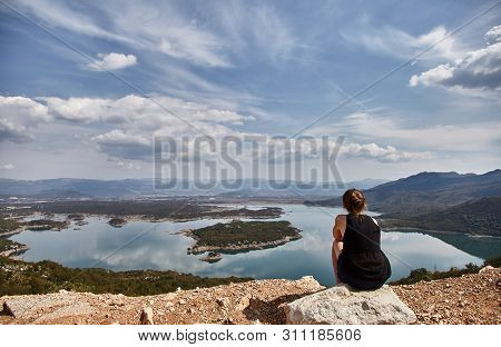 Slansky Lake. The Young Girl Looks At The Lake. A Woman Admires The Beauty Of Montenegro. Montenegro