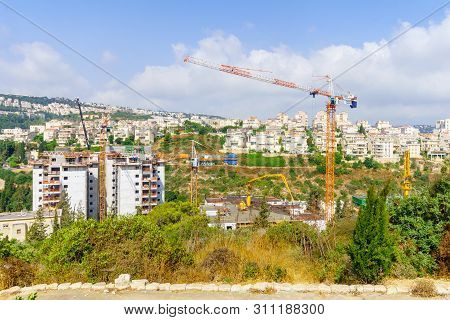 Haifa, Israel - July 12, 2019: Construction Site Of Apartment Buildings, With Workers. Its An Urban 
