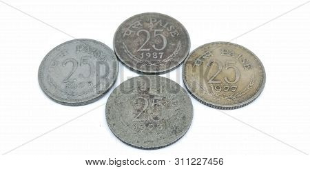 A Picture Of Twenty-five Paise Coins On A White Background