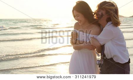 Young Asian Lesbian Couple Running On Beach. Beautiful Women Friends Happy Relax Having Fun On Beach