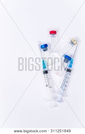 Veterinary And Medical Glass Vials And Two Syringes For Vaccination On A White Isolated Background. 