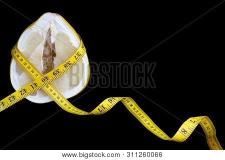 Cut Pamello Fruit Or Pamela Fruit With Juicy Pulp Wrapped With Measuring Tape With Centimeters And I