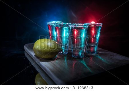 Club Drink Concept. Tasty Alcohol Drink Cocktail Tequila With Lime And Salt On Vibrant Dark Backgrou