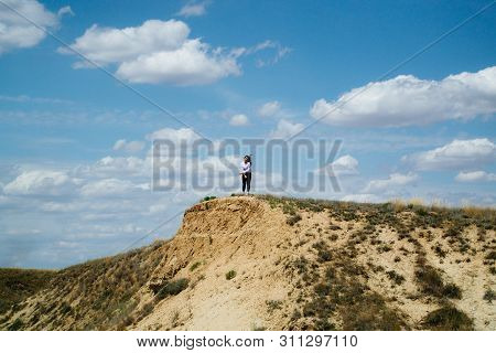 Distant Hills. Hilly Steppe. Curvy Hills. Blue Sky And Grass. Beautiful Plain.