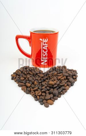 Kuala Lumpur, Malaysia - July 03, 2019:  Promotional Red Nescafe Mug On White Background. Selective 