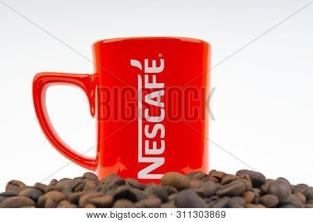 Kuala Lumpur, Malaysia - July 03, 2019:  Promotional Red Nescafe Mug On White Background. Selective 
