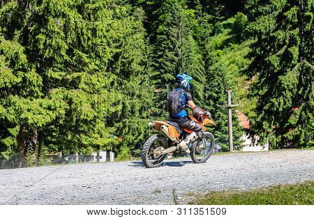 Iezer Mountains - Romania - 2019. Young Biker Having A Ride In The Forest Of Iezer Mountains On A Cr