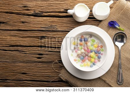 Thai Sweets And Colorful Ball Flour In A White Cup On Asackcloth,  On An Old Wooden Table Rainbow Sw