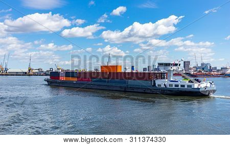 Container Ship And Logistics At Rotterdam Port