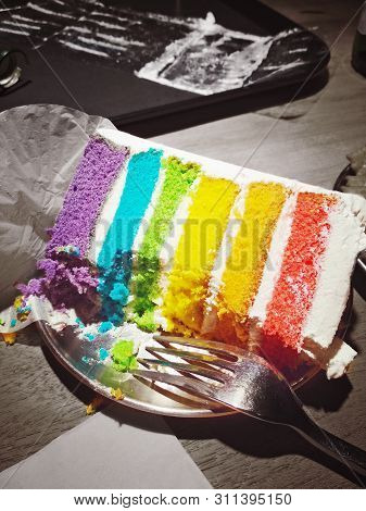 Rainbow Yummy Cake, Half Eaten. Purple, Blue, Green, Yellow, Orange, Red. Finish It All To Brighten 
