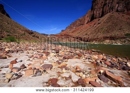 Colorful Boulder Beach At Hance Rapids In Grand Canyon National Park, Arizona.