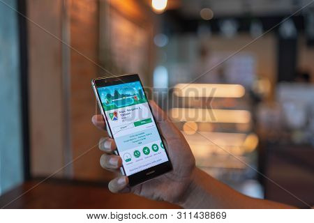 Chiang Mai, Thailand - June 09,2018: Man Holding Huawei With Google Maps On The Screen.google Maps I