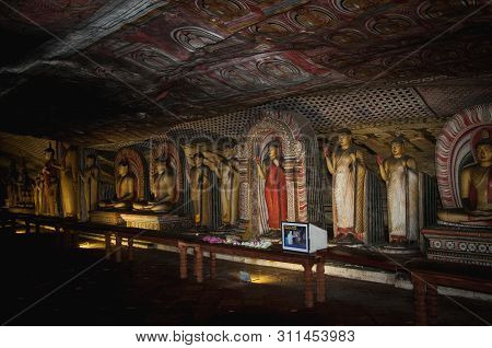 Dambulla, Sri Lanka - April 09, 2017: Statues Of Buddha In The Ancient Dambulla Cave Temple. Sri Lan
