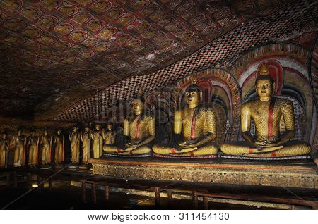 Dambulla, Sri Lanka - April 09, 2017: Statues Of Buddha In The Ancient Dambulla Cave Temple. Sri Lan