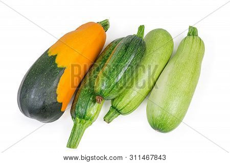 Different Fresh Raw Vegetable Marrows And Zucchini On A White Background, Top View