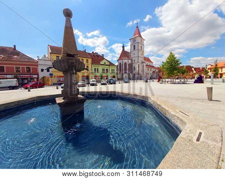 Horazdovice / Czech Republic - June 10, 2019: On Square of Peace (Mirove namesti) we find a fountain and church of St. Peter and Paul, built in 1260-1273.