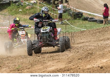 Brezova Nad Svitavou, Czech Republic - June 15, 2019: Rider In Black On A Quad Bike Is A Passing Tur