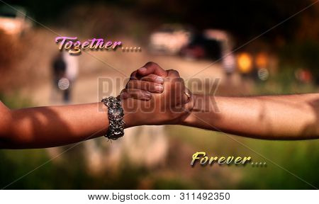 Couple To Be Wedded Holds Hands During Prewedding Photo Shoot