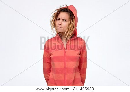 Mixed Race Female Looking At Camera With Distrust, Eyes Full Of Disappoinment