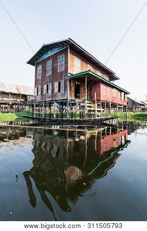 Maing Thauk, Myanmar - April 2019: Traditional Burmese Floating House On Water In Inle Lake