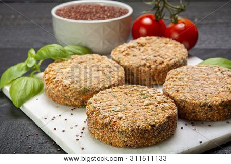 Tasty Vegetarian Burgers Made From Healthy Quinoa, Basil, Tomatoes And Mozzarella Cheese