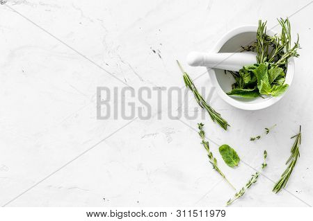 Alternative Medicine With Medicinal Herbs On White Marble Background Top View Mock Up