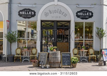 People Shopping In The Old Houses Of Odense On Denmark