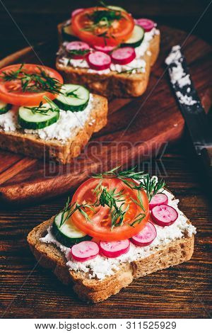 Vegetarian Sandwiches With Fresh Sliced Tomatoes, Cucumber And Radish